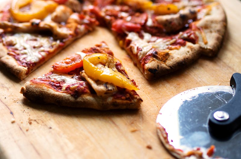 Spicy Italian sausage pizza with peppers and oregano