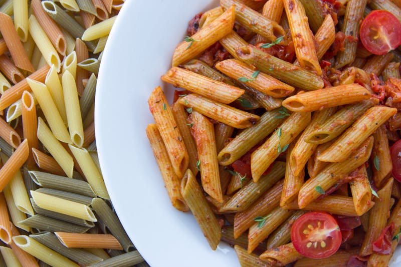 Penne arrabbiata pasta with spicy tomato sauce and basil
