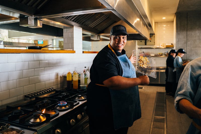 Mod Pizza kitchen team preparing fresh mod pizza